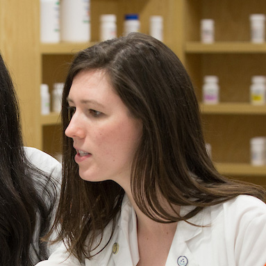 Woman in lab coat.