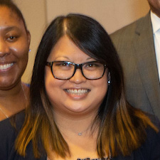 image of Smiling Student wearing glasses.
